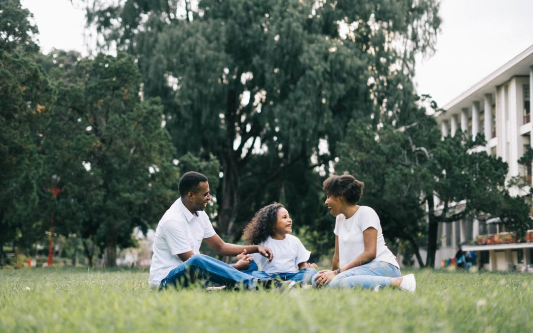 Family Sitting on Grass - Healing After Divorce Blog