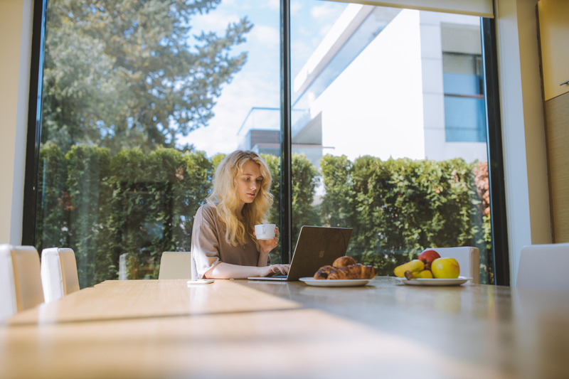 blonde woman computer finance