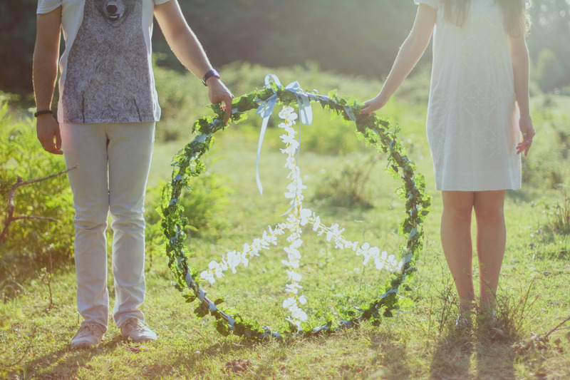 two people holding a peace sign