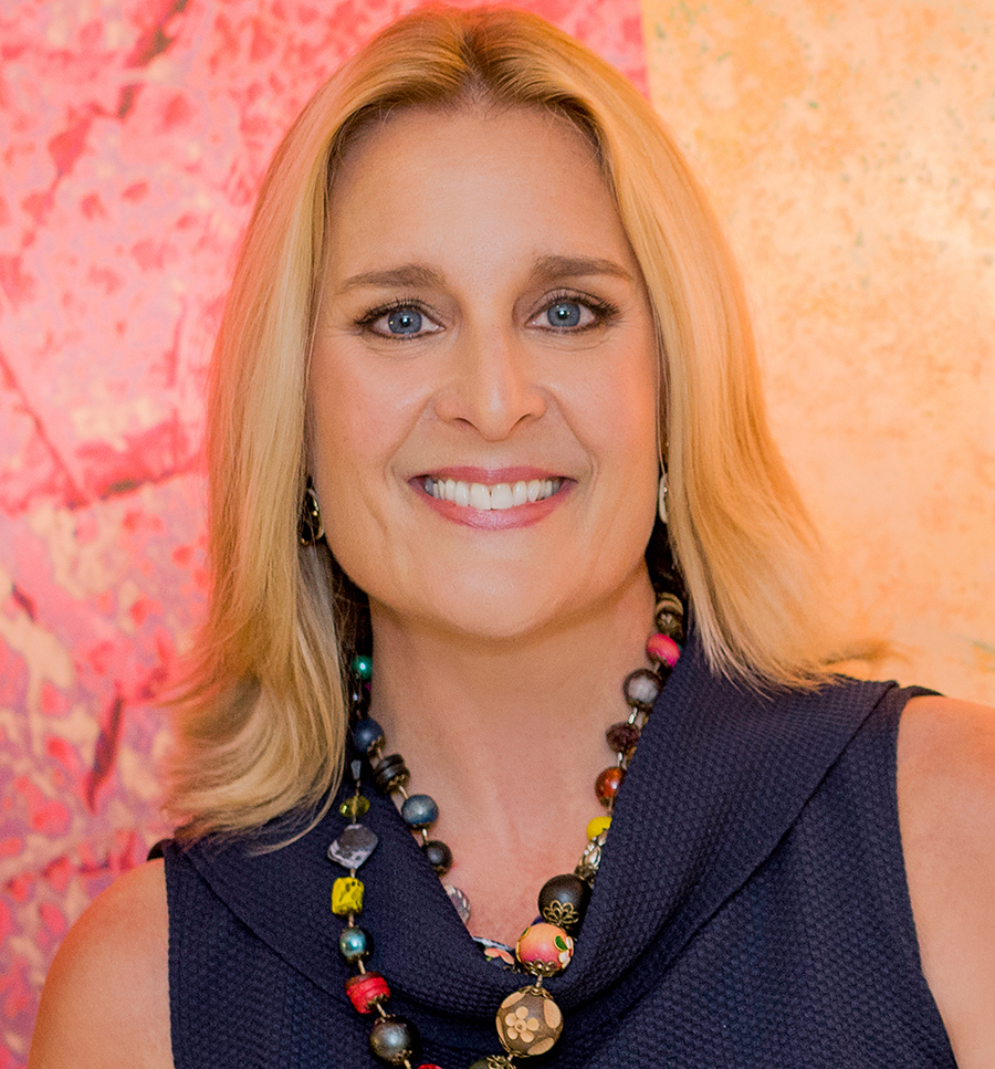 Headshot for marketing materials REV2 (1) blonde woman pink background
