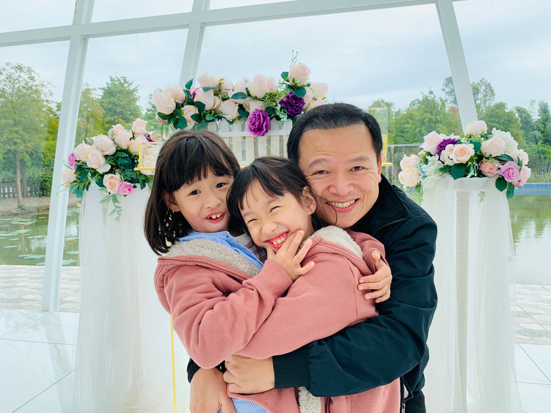 Canva - Portrait Of Two Girls With Their Father dad and kids