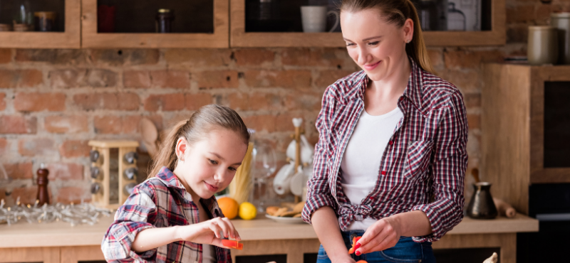 mom and daughter cooking