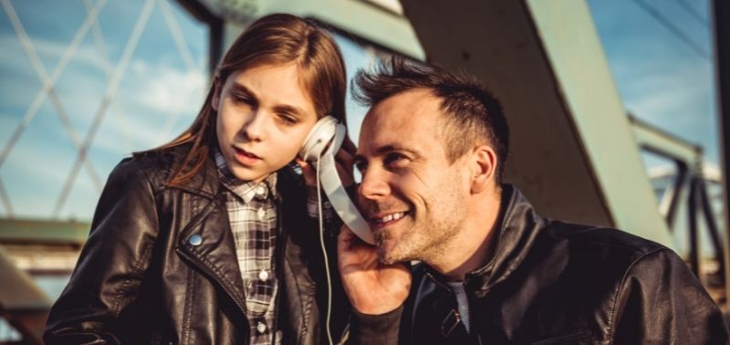 dad and daughter listening to music